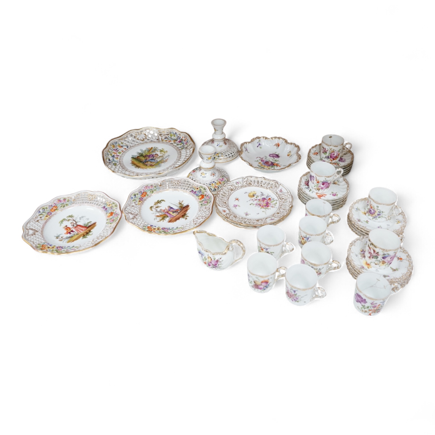 A Dresden porcelain part tea set together with reticulated side plates, largest 26cm in diameter